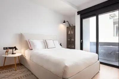 a white bedroom with a large bed and a window at Luxury Apartment, Athens Center, 