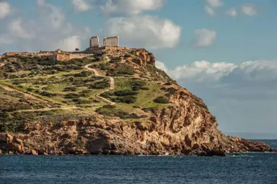 an island in the ocean with a castle on top at Villa Aura - Thymari in Sounio