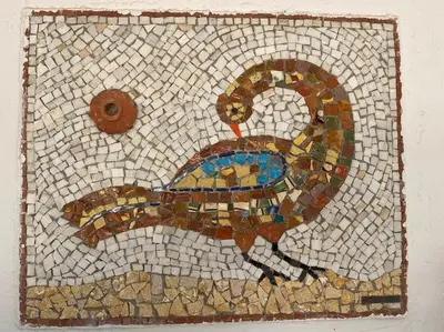 a mosaic of a peacock on a wall at Villa Aura - Thymari in Sounio