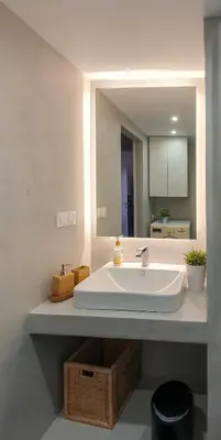 a bathroom with a white sink and a mirror at Acropolis Terrace View Apartment in Athens