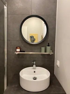 a bathroom with a sink and a mirror at City Boho studio in Athens