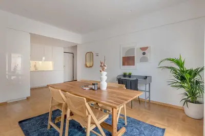 a dining room with a wooden table and chairs at Flawless 1BR Apartment in Athens by UPSTREET in Athens