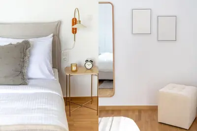 a bedroom with a bed and a mirror at Flawless 1BR Apartment in Athens by UPSTREET in Athens