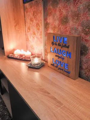 a counter with some candles and a sign on it at Green ART House Athens in Athens