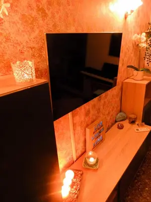 a room with a table with candles and a mirror at Green ART House Athens in Athens