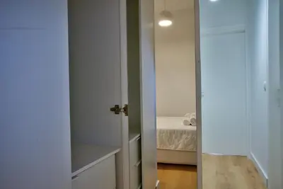 a room with a door and a bedroom with a bed at The Cosy luxurious Seaside Apartment in Athens