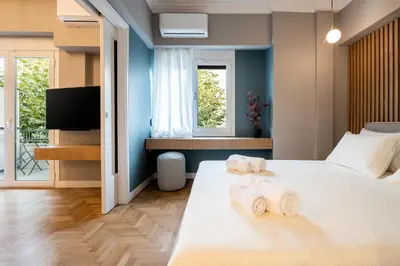 a bedroom with a bed with towels on it at Frinichou 18 by Athens Concept Residences in Athens