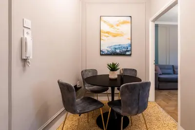 a dining room with a table and chairs at Frinichou 18 by Athens Concept Residences in Athens