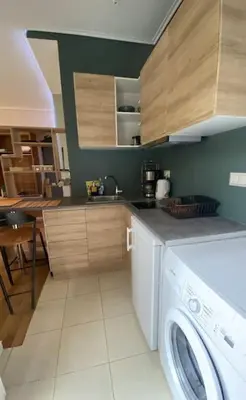 a kitchen with a washing machine in a kitchen at Studio for a couple in Athens