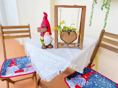 a table with a mirror and a plant on it at Cozy fairytal garden apartment, Family Friendly, Free parking, 15 Min to Airport in Athens