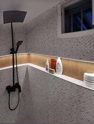 a bathroom with a shower and a sink at Keti's home in Athens