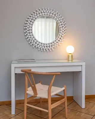 a desk with a mirror and a chair at The Southern Mansion Athens in Athens