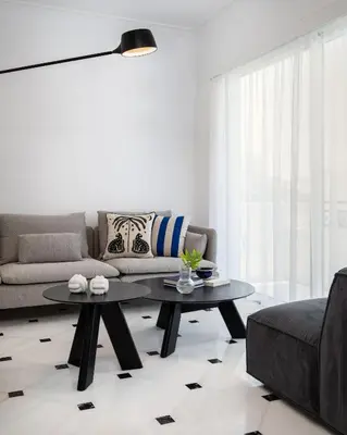 a living room with a couch and a coffee table at The Southern Mansion Athens in Athens