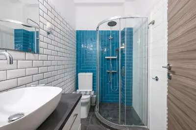 a bathroom with a shower and a sink and a toilet at Supreme Athens Home by Cloudkeys in Athens