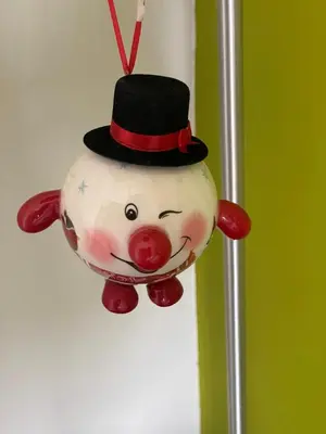 a christmas ornament of a snowman with a top hat at House in riviera lagonisi in Kalívia Thorikoú
