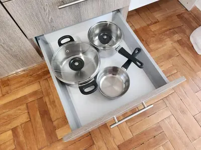two pots and pans on a stove in a kitchen at Attiki Rooftop Apartment VIPGreece in Athens