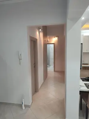 an empty room with a kitchen and a hallway at Apartment in the Center of Athens in Athens