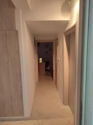 an empty hallway with a hallway leading to a room at Apartment in the Center of Athens in Athens