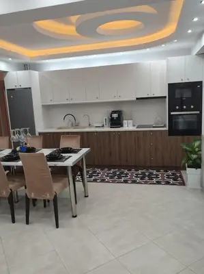 a kitchen with a table and chairs and a counter at Apartment in the Center of Athens in Athens