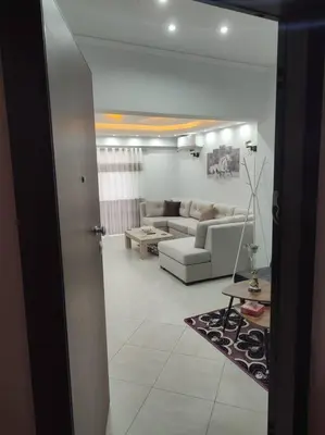 a living room with a couch and a table at Apartment in the Center of Athens in Athens
