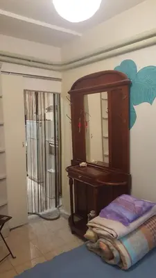 a room with a mirror and a dresser and a bed at Comfy home 35sqm near National Garden in Athens