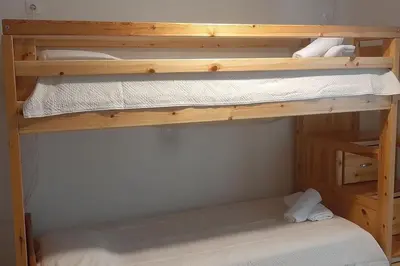 a couple of bunk beds in a room at Το σπίτι του καπετάνιου στη Βουλιαγμένη in Athens