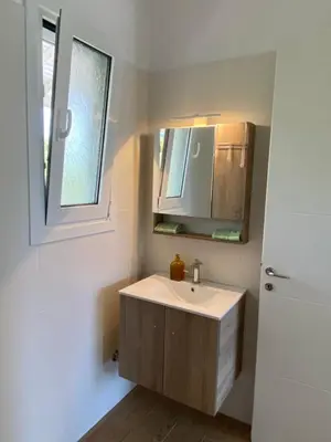 a bathroom with a sink and a mirror at Euphoria Estate in Agia Marina Aegina