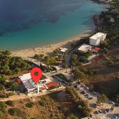 an aerial view of a beach with a red arrow at BY THE SEA ROOMS, AVLAKI in Porto Rafti
