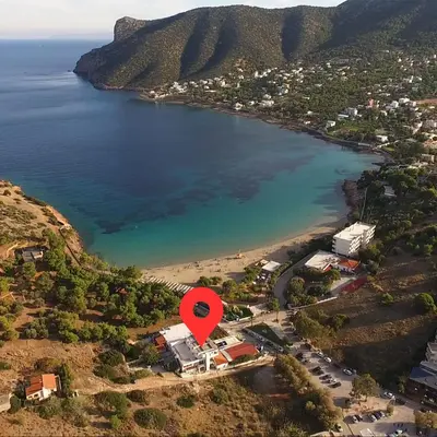 an aerial view of a beach with a red marker at BY THE SEA ROOMS, AVLAKI in Porto Rafti