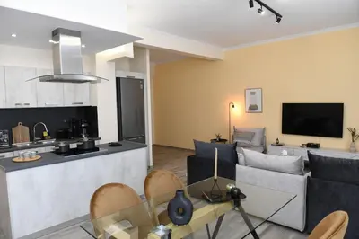 a living room with a couch and a table at Konstantina Apartment in Athens