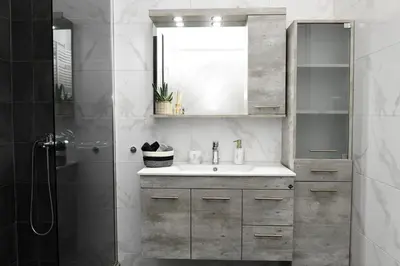 a bathroom with a sink and a shower at Alkmini Apartment in Athens