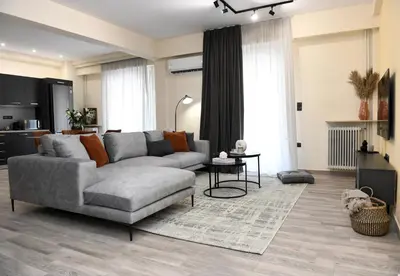 a living room with a couch and a table at Alkmini Apartment in Athens