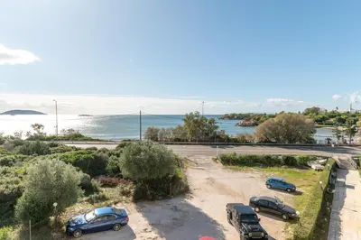a group of cars parked in a parking lot at Amazing sea view apartment in Lagonissi in Kalívia Thorikoú
