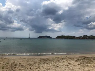 a beach with a cloudy sky and the ocean at Daniel's House - Palaia Fokaia in Palaiá Fókaia