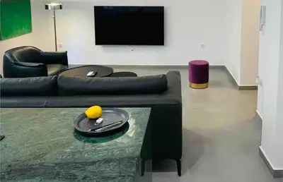 a living room with a couch and a table at 3 bedroom New Modern Flat in the heart of Athens in Athens