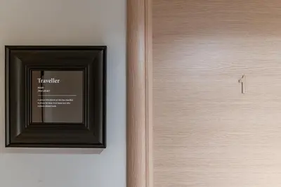 a wooden door with a picture on the wall at Fantastic sea view one-bedroom apartment - Lagonissi in Lagonissi