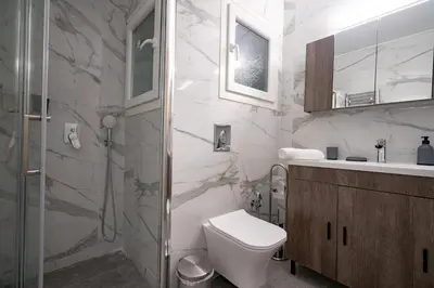 a bathroom with a toilet and a shower and a sink at Koukaki 1 bedroom 4 persons apartment by MPS in Athens