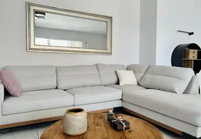 a living room with a couch and a table at Sea, La Vie in Saronida