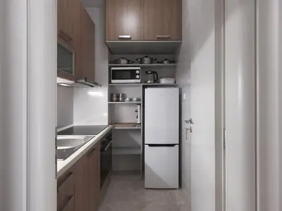 a small kitchen with a white refrigerator and wooden cabinets at AnapironPolemou5-Eleutheriou in Athens