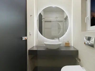 a bathroom with a sink and a mirror at Iliodorou2-4 in Athens