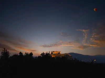 a building on top of a hill at sunset at Iliodorou2-4 in Athens