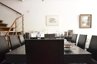 a dining room with a table and chairs at Veggie Garden Athens B&B in Athens