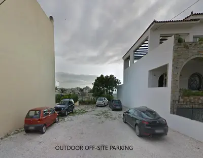 a group of cars parked next to a building at The Cellar Studios - by Avelink in Spáta