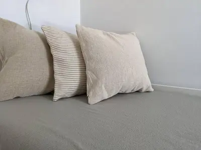 two pillows sitting on top of a bed at Rooftop Studio with Acropolis & Sea view in Athens