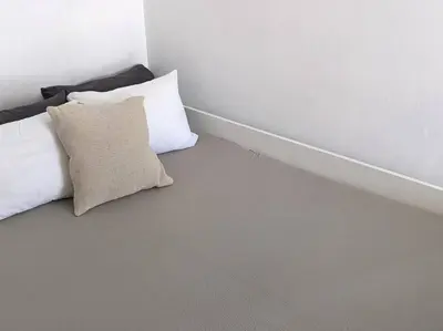 a bed with two pillows in a room at Rooftop Studio with Acropolis & Sea view in Athens