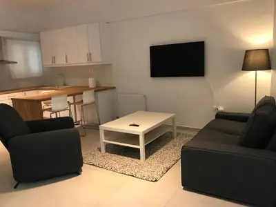 a living room with a couch and a table at Apartment For 4 Ppl In N. Smirni in Athens