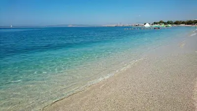 a beach with clear blue water and a sandy shore at Studio47 in Athens