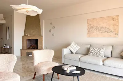 a living room with a couch and chairs and a table at Pame Rentals - 1BD Apartment with Sea View in Athens