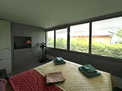 a bedroom with a bed with two towels on it at Glyfada's Luxury Apartment in Athens