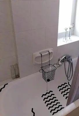 a bathroom with a shower with a black and white floor at Hope house Kavouri in Athens